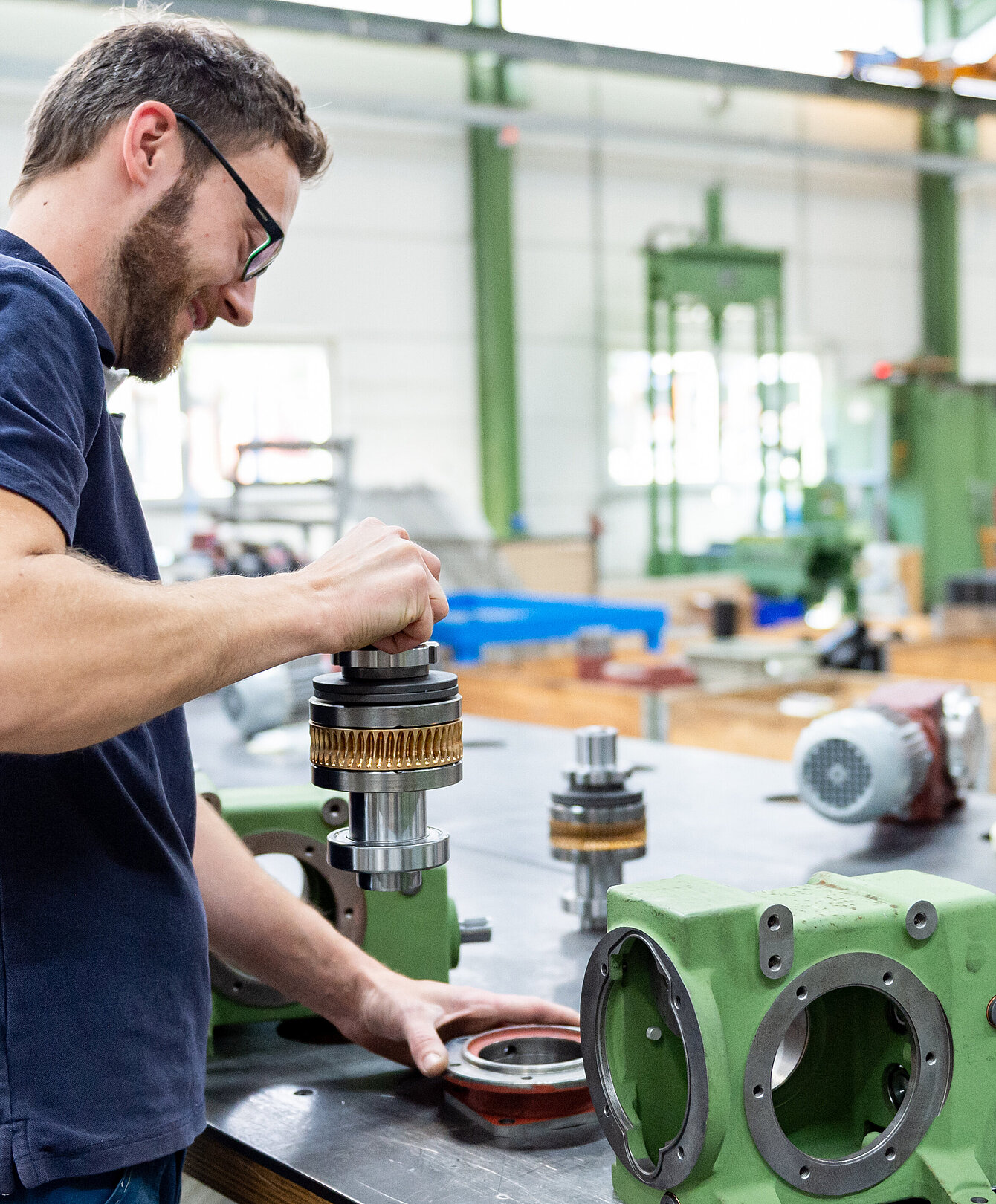 Our qualified staff provides professional repairs and overhauls Technician assembling an electric motor in the service area